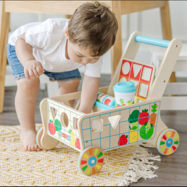 Wooden stroller with set of educational toys